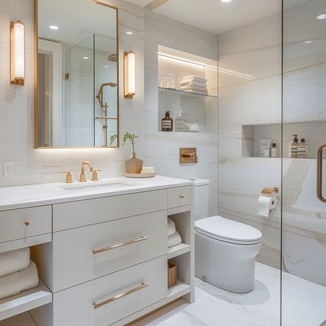 Contemporary bathroom design with white vanity, gold faucets, glass shower enclosure, and natural accents. Bathroom Design Simple, White And Gold Bathroom, Contemporary Bathroom Design, Glass Shower Enclosures, Contemporary Bathroom Designs, Gold Bathroom, White Vanity, Home Decor Color, Stylish Bathroom