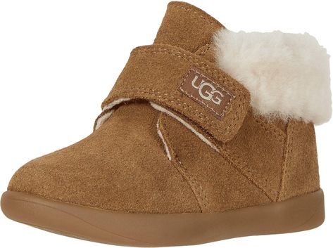 PRICES MAY VARY. Suede upper Exposed 10mm sheepskin collar Adjustable hook and loop closure Microfiber lining Flexible, lightweight molded rubber outsole Toddler Uggs, Toddler Ugg Boots, Baby Ugg Boots, Baby Uggs, Toddler Boots, Kids Uggs, Small Baby, Baby Sneakers, Hook And Loop