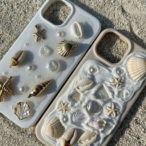 "Introducing latest trend straight out of Pinterest to you all. : custom silicon phone cases adorned with charms and pearls! Personalize yours to reflect your unique style and make your phone truly stand out." DM to order💌 [ phonecase, pinterest, pinterestphonecase, siliconphonecases, pinterestinspired, seashellphonecase] #charmsjewelry #phonecase #pinterest #pinterestphonecase #siliconphonecases #pinterestinspired #pinteresttrending #seashellphonecase Beach Aethstetic, Silicon Phone Cases, Seashell Case, Seashell Phone Case, Beach Phone Case, Shell Phone Case, Silicone Phone Covers, Shells Diy, Decoden Phone Case