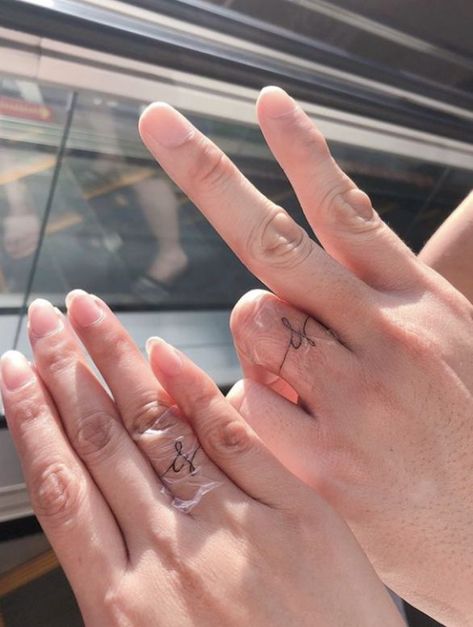 Wedding Tattoo Initials, Tattoo Ring Finger Initials, Ring Finger Marriage Tattoo, Fine Line Wedding Band Tattoo, Tattoos For Wedding Finger, Initial On Wedding Finger, Spouse Finger Tattoo, Tattoo Wedding Rings Initials, Wedding Finger Initial Tattoo