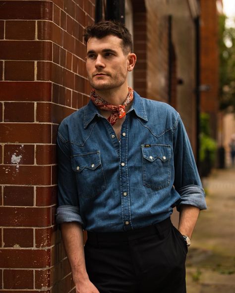 enim western shirt and bandana around the neck, a childhood of watching spaghetti westerns tell... 📷 @_johnjarrett #denim #westernshirts Neck Bandana Outfit Western, Bandana Outfit Men, Bandana Outfit, Denim Shirt Outfit, Denim Western Shirt, Denim Outfit Men, Bandana Men, Men Fashion Photoshoot, Uniform Style