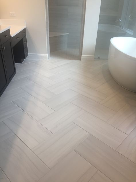 Master Bathrooms Floors, Spa Bathroom Vanity Ideas, Large Format Bathroom Floor Tile, Large Floor Tile Bathroom, Florida Tile Floors, Marble Lvp Flooring Bathroom, Large Herringbone Tile Floor Bathroom, Lvp Flooring In Bathroom, Ceramic Tile Bathroom Floors