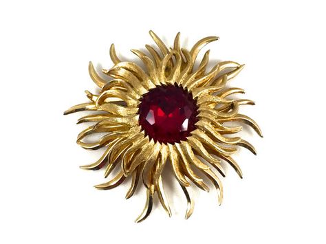 New listings daily follow us for updates.  This beautiful #vintage rhinestone #sunburst #brooch in a gold tone Mid Century multi dimensional design, circa 1960s. The large round faceted rhinestone has a gold foil back.... #teamlove #etsyretwt #jewelry #jewellery #figural #textured ➡️ https://www.etsy.com/justvintage4u/listing/477956138/vintage-rhinestone-sunburst-brooch-gold?utm_campaign=products&utm_content=60e5f4d2553f42ef97250590cc631c0a&utm_medium=pinterest&utm_source=sellertools Vintage Gold Brooch, Gold Sunburst, Multi Dimensional, Gold Brooch, Antique Brooches, Brooch Vintage, Gold Brooches, Red Rhinestone, Vintage Vogue