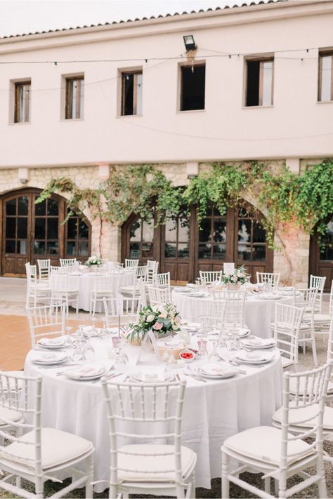 Wedding dinner setup with round tables and Tiffany white chairs. Simplicity for a rustic winery wedding in Crete | Crete for Love White Chairs Wedding, Rustic Winery Wedding, Rustic Winery, Dinner Setup, Wedding Reception Chairs, Tiffany White, Round Wedding Tables, White Round Tables, Tiffany Chair