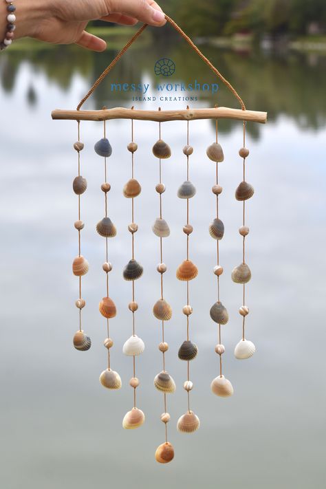 An eclectic gift which will bring good vibes to your living space! Handmade by @messyworkshop and available now on Etsy #messyworkshop #islandcreations #handmade #seashellwindchime #southpadreisland #SPI #texas #motherofpearl #beads #beachdecor #beachvibes Seashell Decorations Diy, Seashell Wind Chime, Seashell Art Diy, South Padre Island Texas, Padre Island Texas, Seashell Wind Chimes, Sea Shells Diy, Deco Marine, Eclectic Gifts