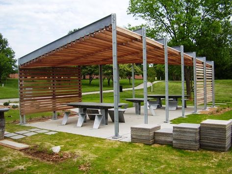 A picnic shelter with picnic tables in a city park Park Shade Structure, Picnic Shelter, Modern Gazebo, Park Pavilion, Pavilion Architecture, Shelter Design, Landscape Structure, Outdoor Shelters, Pavilion Design