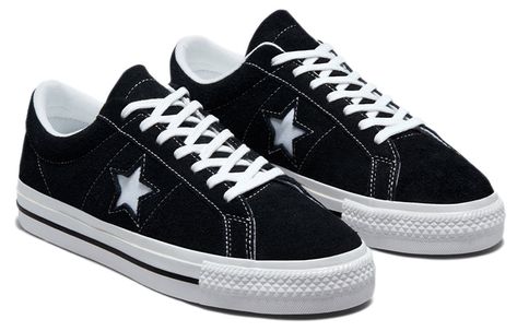 Known for decades as part of the Converse family, the One Star Low 'Black White' sneaker provides a classic style with modern performance features. Originally releasing in 1974, this timeless design is now proudly reincarnated with improved comfort, versatility, and durability. Its low profile and rubber-backed suede upper give maximum flexibility without compromising protection or sturdiness. While looking stylish on city streets, this sneaker also delivers remarkable boardfeel and impact suppo Converse One Star Outfit, Converse Shoes High Top, Converse One Star Black, Basic Sneakers, Black And White Converse, All Star Converse, Converse Low, Star Converse, Basic Shoes