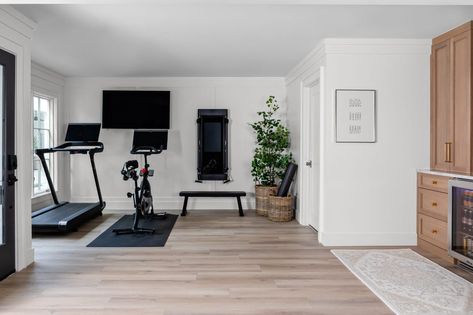 a room with a piano and a plant in it Where To Put Treadmill In House, Peloton Treadmill Room Ideas, Home Gym With Tv, Home Gym Tonal, Home Office And Gym Combo, Home Office Gym Combo Layout, Home Office Gym Combo, Small Workout Room, Home Gym Office Combo