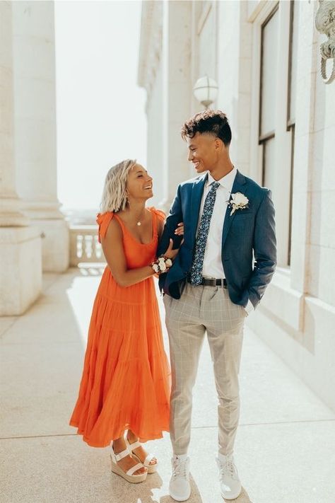 Spring Wedding Guest Couple Outfit, Orange Dress Couple Outfit, Hoco Photography Poses, Matching Couple Wedding Guest Outfits, Couple Formal Outfits Classy, Hoco Boys Outfits, Hoco Couple Outfits, Mormon Prom, Couple Prom Pictures