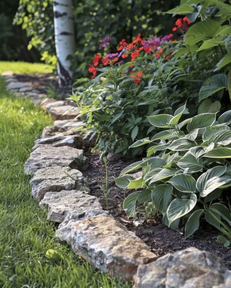 9 beautiful garden bed edging ideas Natural Stone Flower Bed Edging, Stone Garden Bed Edging, Natural Stone Garden Border, Limestone Landscape Edging, Rock Borders Edging Garden Beds, Rock Lined Flower Bed, Rock Landscape Edging, Mulch Bed Edging, Flower Bed Trim