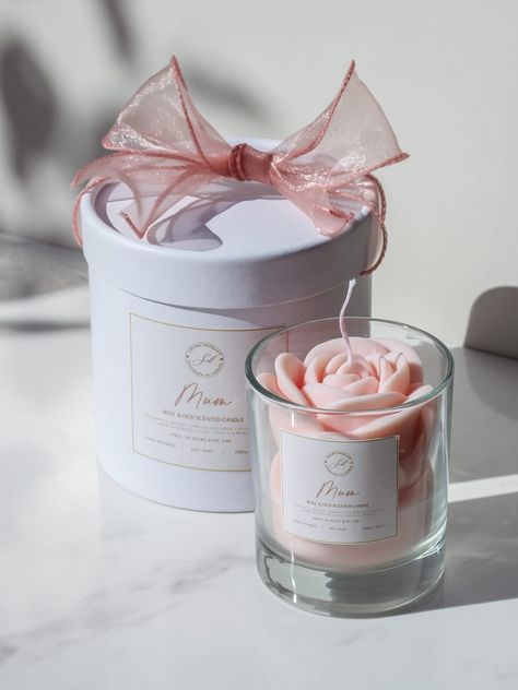 Experience luxury with our Rose Candle, featuring a captivating blend of peony and oud. This elegant scented candle is the perfect gift for mum, offering a soothing ambiance and a touch of sophistication. A unique candle gift ideal for Mother's Day, birthdays, or just to show your appreciation. Surprise Mum with a memorable fragrance that fills the room and creates a calming atmosphere. This is a thoughtful, unique, and beautifully packaged gift she'll love. Oud Candle, Pie Candles, Candle Surprise, Pink Candle, Cream Candles, Candle Gifts, Candle Ideas, Candle Gift Box, Elegant Candles