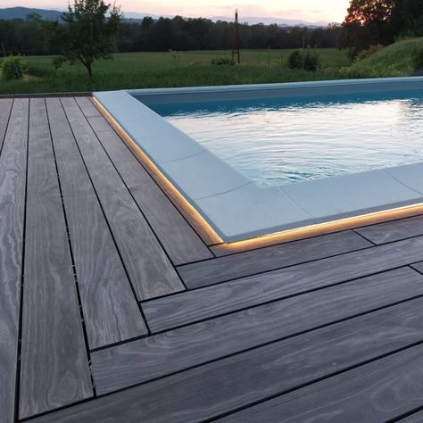 Accoya Color pool decking with LED lighting - Accoya Acetylated Wood | High performance, long life modified wood project case study Pool With Wood Around, Wood Around Pool, Pool With Wood Deck, Pool Wood Deck, Decking Around Pool, Wooden Pool Deck, Wood Pool Deck, Decks Around Pools, Pool Decking