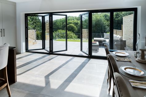 Stunning Aluminium Bi Folding Doors from Bi Folding Door Prices, Design, Price and order instantly online. Available with 12 months 0% finance, either professionally fitted or for DIY. Choose from 2-7 Panel designs in a range of stock colours, bespoke RAL colours are also available. We are the bi fold door experts and we are here to help. #bifold #bifoldoor #bifoldingdoors #aluminiumbifolds #concertinadoors Large Bifold Doors Indoor Outdoor, Bifold Servery Window, Alfresco Bifold Doors, Bifold Doors Onto Patio, Black Aluminium Bifold Doors, Prices Design, Aluminium Bi Fold Doors, External Bifold Doors, Bifolding Doors