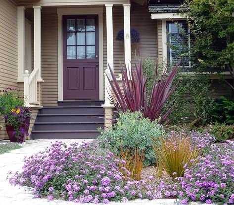 The dark steps look great against the purple door and beige siding. Dark Tan House Exterior, Purple Trim House Exterior, Houses With Purple Front Door, Black House With Purple Door, Grey House Purple Door, Beige Siding, Red Brick Purple Door, Accent Door, Purple Front Doors