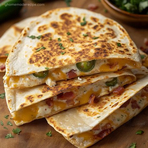 These Jalapeño Popper Quesadillas combine the flavors of jalapeño poppers with a cheesy quesadilla for the ultimate appetizer. They’re easy to make and great for sharing, featuring a crispy tortilla, melty cheese, and a spicy kick from the jalapeños. Kfc Potato Wedges, Cheesy Quesadilla, Snacks And Appetizers, Sweet Potato Cheesecake, Meal Plan Keto, Jalapeño Poppers, Free Keto Meal Plan, Caramelized Bananas, Low Carb Treats