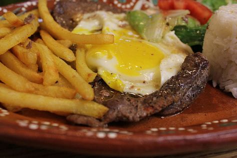 Bitoque - Portuguese steak with egg  Always get this when I'm in little Portugal Bitoque Portuguese Recipe, Portuguese Fried Fish, Azorean Recipes, Portuguese Steak And Egg Recipe, Portuguese Steak, Bife A Casa Recipe, Bitoque Portuguese, Visiting Portugal, Portuguese Foods