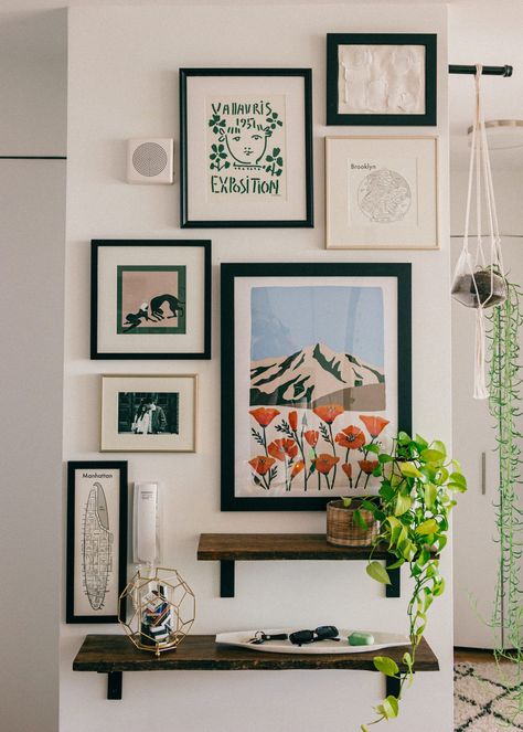 Make a statement with this easy to create gallery wall in your home! An affordable and easy update to any space... #gallerywall #statementwall #artprints #frames #gallery #entryway #nyc #apartmentstyle #bloggerhome #homedecor #interiordecorating #decor #homestyle #midcentury #modernhome #nycapartment #bloggerhome #apartment #interiorstyle #apartmenttherapy #houseplants Organize Frames On Wall, Casual Gallery Wall, Natural Gallery Wall, Shelf And Gallery Wall, Apartment Frame Decor, Gallery Wall Contemporary, Art Wall Inspo Aesthetic, Mini Gallery Wall Small Spaces, Trendy Gallery Wall Ideas