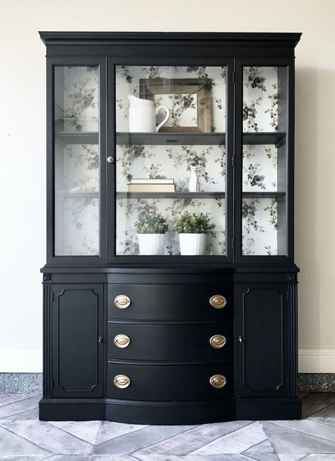 There is nothing better than a classic black. Lamp Black transformed this dated china cabinet into something both timeless and modern. Queenstown Gray was used to accent the interior. The china cabinet back was lined in a fabulous Magnolia Home wallpaper. The original Hepplewhite pulls were updated to an Antique Gold color. Simply stunning! Black China Cabinet, China Cabinet Makeover, Painted China Cabinets, Redo Cabinets, Hutch Makeover, Black China, Cabinet Makeover, Furniture Rehab, Furniture Renovation