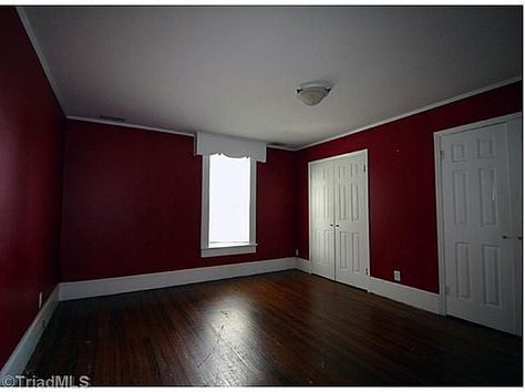 Red walls/white trim/dark wood Dark Red Bedroom Walls, Dark Red Wall Paint, Maroon Wall Paint, Dark Red Walls Bedroom, Red Walls Bedroom, Red And White Room Aesthetic, Red Wall Bedroom, Dark Red Bedroom Aesthetic, Red Wall Color