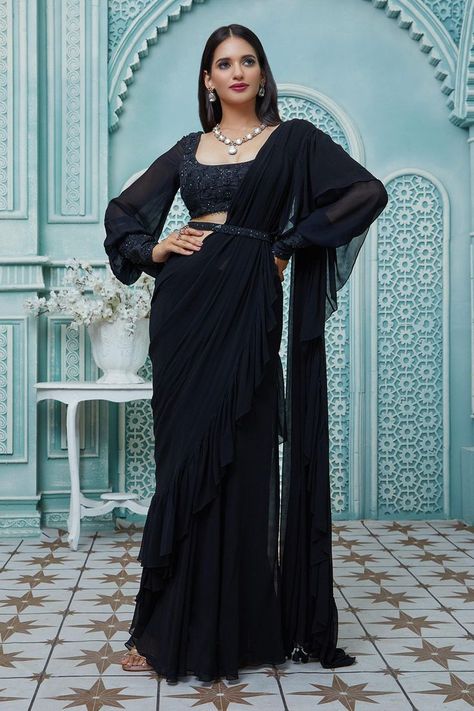 Buy #black #draped #saree with #ruffle borders. Paired with #floral #embroidered puff #sleeve #blouse & embroidered belt by #AriyanaCouture at #AzaFashions Shop online now at #Azafashions.com Call +91 8291990059 or email contactus@azafashions.com for enquiries. #wedding #festive #ethnic #tradional #shopping #shoponline #party #reception #bride Couture, Black Saree Blouse Designs, Black Saree Designs, Black Saree Blouse, Long Skirt And Top, Embroidered Cuffs, Draped Saree, Saree Wearing Styles, Fancy Sarees Party Wear