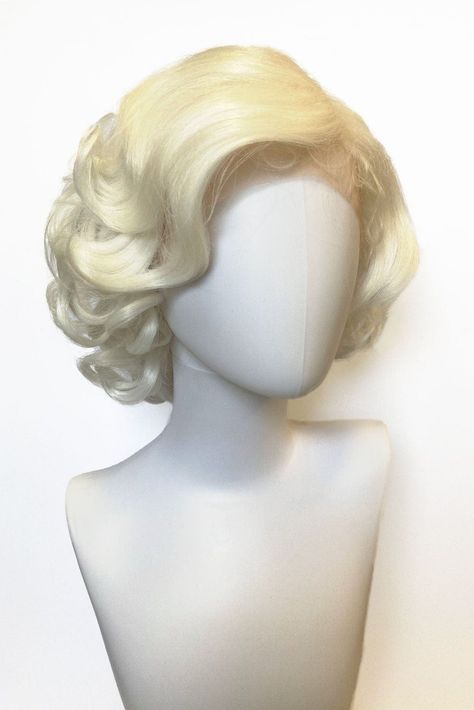 Blonde pinup style lace front wig Marilyn Monroe style with vintage waves Find out if blondes really have more fun... Marilyn's gorgeous curls and waves are the embodiment of the lady herself oozing old-school glamour and charm. We dare you not to be noticed in her! Made from the highest quality vegan fiber, which is so soft and silky, it feels like real hair. Details: WEIGHT: 120 grams LACE FRONT PIN UP WIG LENGTH: 13 inches / 33 cms LACE FRONT: Full lace front and lace part wig DENSITY: Full s Blonde 50s Hair, Marilyn Monroe Haircut, Marilyn Monroe Wig, Blonde Short Wig, White Blonde Wig, Blonde Pinup, Short Blonde Wig, Blond Bombshell, Marilyn Monroe Hair