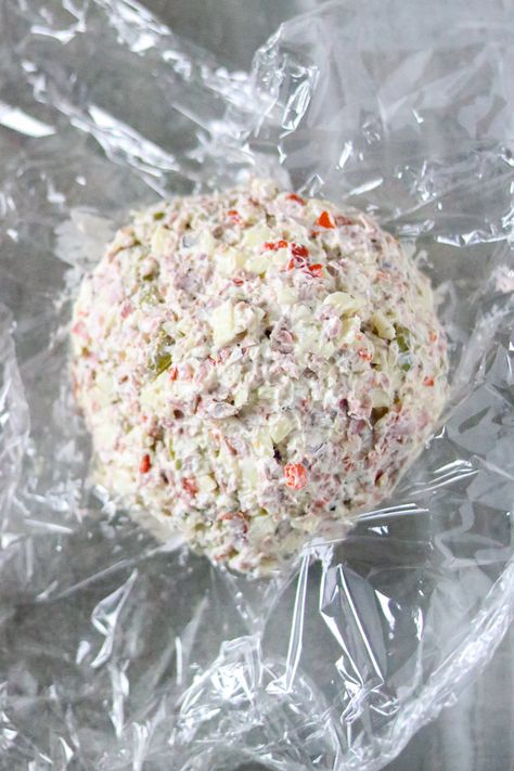 This Muffuletta Cheese Ball tastes like a classic New Orleans muffuletta sandwich. The flavors of salty olives, provolone cheese, and salami go well with cream cheese and Italian seasonings spread on a cracker. It's a quick and easy appetizer, snack food, or party food. Salami Cheese Ball, Olive Cheese Balls, Italian Cheese Ball, Best Italian Dishes, Beef Olives, Muffuletta Sandwich, Appetizers Cheese, Italian Seasonings, Cream Cheese Ball