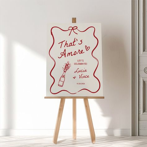 Welcome your guests with charm using our "That's Amore" Engagement Party Welcome Sign! This Canva template features a whimsical, wavy hand-drawn design, adding a touch of romance and fun to your celebration. Easily customizable to fit your unique style, it sets the perfect tone for an unforgettable engagement party. Perfect for couples who want to celebrate their love with a playful and stylish touch! 𝗧𝗛𝗔𝗧'𝗦 𝗔𝗠𝗢𝗥𝗘 𝗕𝗨𝗡𝗗𝗟𝗘: https://www.etsy.com/ca/listing/1792741823/thats-amore-bri Table Setting Engagement Party, Thats Amore Sign, Italian Style Engagement Party, Love At First Swipe Engagement Party, Italian Engagement Party Decorations, Woodsy Engagement Party, Pink And Green Engagement Party, Red Welcome Sign, Galentines Party Theme