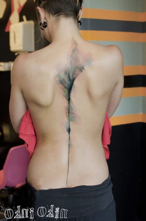 watercolor-back-tattoo-along-spine-flower-wrist-tattoos-black-pants Watercolor Hand Tattoo, Faded Color Tattoo, Spine Watercolor, Tattoo Plume, Watercolour Tattoo, Watercolour Tattoos, G Tattoo, Skin Tattoo, Tattoo Watercolor