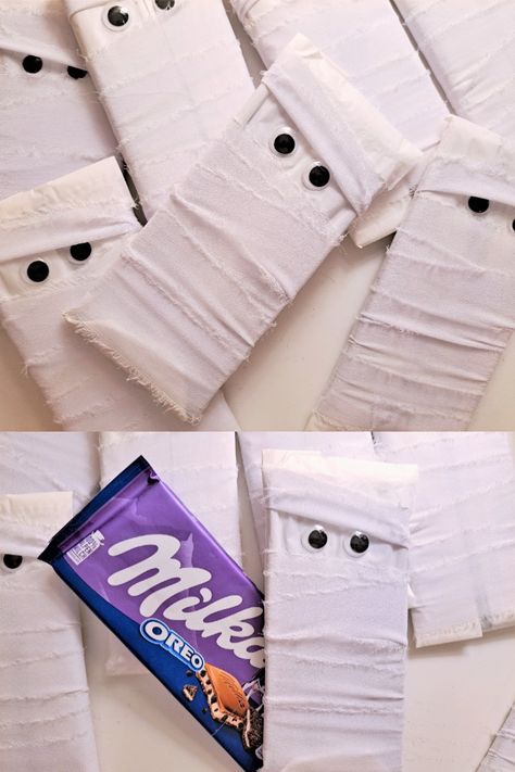 Halloween white Mummy wrapped Chocolate bars for children! These creative candy for kids are an awesome trick or treat candy idea for your party! What you get: Each mummy consists of a Milka chocolate bar wrapped with white ribbons. Wiggly eyes are then added to the outer packaging The chocolate bar is unopened and wrapped while still being in its original packaging. Each Milka chocolate bar weighs 100g #halloween #halloweencandy #mummy #creativecandy #sweetsforkids #kidssnacks #chocolatebars Full Size Candy Bars Halloween Ideas, Halloween Candy Wrapping Ideas, Wrapped Chocolate Bars, Creative Halloween Treats, Mummy Treats, Halloween Candy Bar, Chocolate Bars Gift, Milka Chocolate, Chocolate Bar Wrapping