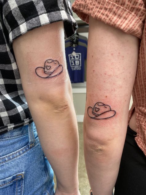 #tattoo #tattoos #matchingtattoos #bestfriendtattoos #countrygirl Duck With Cowboy Hat, Matching Western Tattoos, Small Tattoos Minimalist, Tattoos Cowboy, 3 Friend Tattoos, Cowboy Hat Tattoo, Tattoo Designs Unique, Tattoos Floral, Tattoos Watercolor