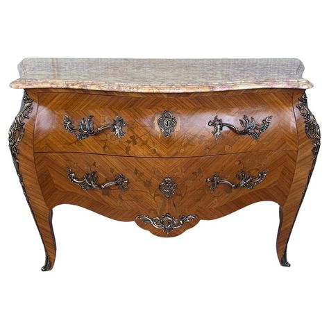 French Louis XV style kingwood veneer commode, the shaped marble top above a bombe case with ormolu bronze mounts, highly decorated throughout with marquetry inlay with two drawers, on short cabriole legs. Linen Press, French Rococo, Chests Of Drawers, Antique Cabinets, Antique Chairs, Cabriole Legs, Antique Ceramics, Wood Sideboard, Rococo Style