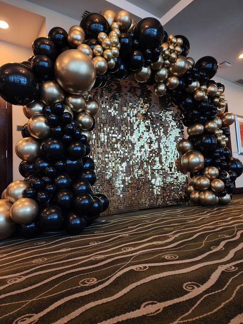 Gold backdrop, balloon arch, gold and black balloon arch, gold shimmer backdrop, party rental, and decoration Masquerade Ball Photo Backdrop, Black Golden Ballons Decoration, Black And Gold Balloons Background, Masquerade Party Balloon Decorations, Gatsby Balloon Arch, Black Prom Send Off Decorations, Black And Gold Birthday Theme Decoration, Masquerade Ball Balloon Arch, Black Balloon Arch Backdrop