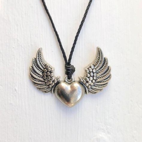 Flying Heart Wing Punk Necklace/Choker Adjustable Necklace Ft. A Dainty Antique Silver Angel Heart Wing (Approx. 1.5” Wide) Placed On A Black Waxed Polyester Cord. Finished W/ Sliding Knot Closure. : Adjustable Knot! (Opens Up To 26") Made Of Durable Zinc Alloy #: Handmade Necklace Healing Crystals Jewelry Metaphysical Stones Gemstones Rocks Reiki Energy Meditation Yoga Protection Earthcore Witchy Wicca Magick Occult Oddities Tarot Slytherin Hobbit Elf Handmade Bracelet Boho Romantic Goth Fairy Angel Heart Necklace, Grunge Jewelry Necklaces Silver, 90s Goth Jewelry, Y2k Jewelry Earrings, Y2k Emo Jewelry, Gothic Jewelry Aesthetic, Goth Handmade Jewelry, Silver Y2k Jewelry, Rockstar Girlfriend Jewelry