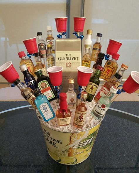 The liquor bouquet we made for a 21st birthday present! Liquor Baskets, Liquor Ideas, Booze Bouquet, Alcohol Bouquet, Liquor Gift Baskets, Liquor Bouquet, 21st Birthday Presents, 21st Bday Ideas, Liquor Gifts