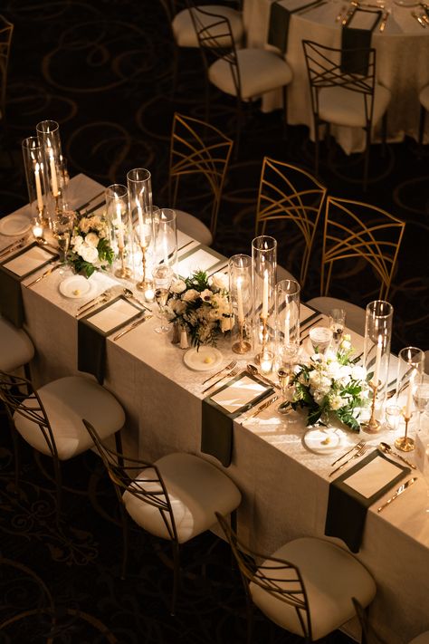 Elegant trios of floral arrangements and gold candlesticks with taper candles along the length of a long guest table. PC: Ann Coen https://www.anncoen.com/photography Long Table Wedding Decor Candles, Gold Taper Candles Wedding, Tall Wedding Centerpieces Long Table, Wedding Centerpiece Candlestick, Floral And Candle Table Decor, Taper Candle Centerpiece Wedding Long Table, Candle Placement Ideas, Taper Candle Centerpiece Wedding Round Table, Candles Long Table Wedding