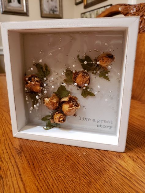 Found my dried wedding bouquet (33 years ago) and made this pretty layered resin wall art with flowers, leaves, and pearl strands. Dried Rose Resin Art, Dried Wedding Bouquet, Dried Flowers Crafts, Art With Flowers, Dried Roses, Flower Shadow, Drying Roses, Flower Shadow Box, Resin Wall Art