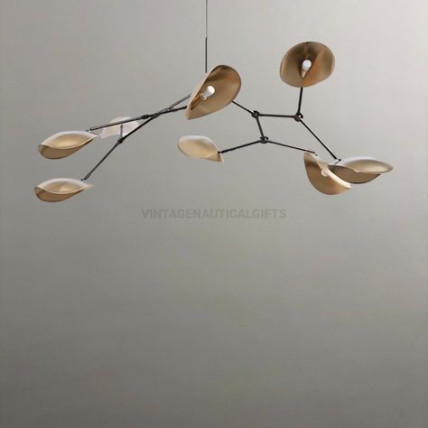 ✪WELCOME TO VINTAGE NAUTICAL GIFTS✪ Elevate your interior design with this exquisite *Modern Mobile Chandelier* that doubles as a stunning piece of kinetic art. Crafted with meticulous attention to detail, this unique chandelier features a series of elegantly shaped brass leaves that are suspended from fine wires, creating a delicate and balanced mobile. Each leaf is designed to move gently, capturing and reflecting light to create a dynamic and captivating visual experience in any room. ★Key Fe Mobile Light Fixture, Vintage Modern Lighting, Modern Ceiling Light Living Room, Starburst Light Fixture, Scandinavian Chandelier, Unique Chandelier, Mobile Chandelier, Starburst Light, Modern Mobile