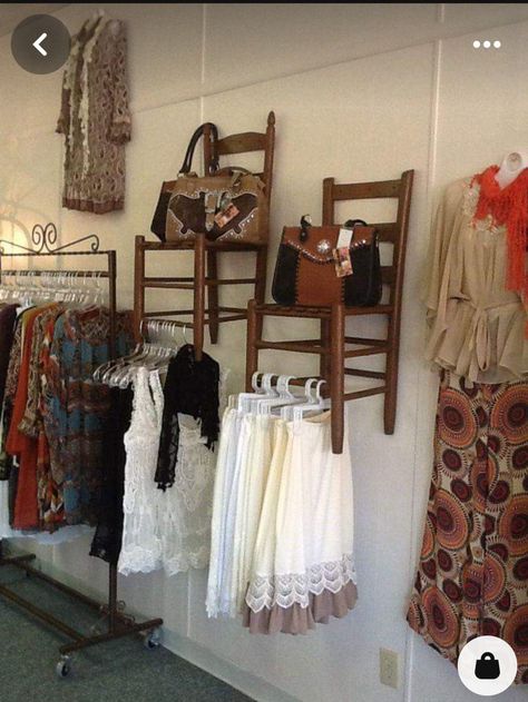 Face Out Clothing Display, Chair On Wall Display, Bohemian Storage Ideas, How To Display Purses In Boutique, Chairs On Wall Display, Chairs Hung On Walls, Vintage Clothing Rack Display, Purse Display Boutique, Vintage Shop Interior Design