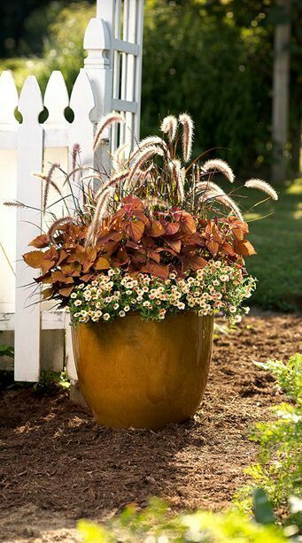 10 Fall Flower Containers With a Unique Twist | Pretty Purple Door Autumn Planters, Fall Flower Pots, Fall Pots, Fall Container Gardens, Fall Containers, Container Garden Design, Fountain Grass, Fall Planters, Container Gardening Flowers