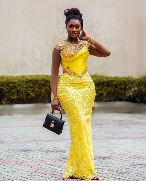 Best and Stunning 2023 Asoebi Gown Styles for Lace. - Ladeey Latest Asoebi Styles Lace 2023, Trending Aso Ebi Lace Styles 2023, Yellow Asoebi Lace Styles, Yellow Lace Asoebi Styles, Asoebi Gown Styles, Lace Gown Styles Nigerian, Nigerian Traditional Dresses, Lace Asoebi Styles, Gown Yellow