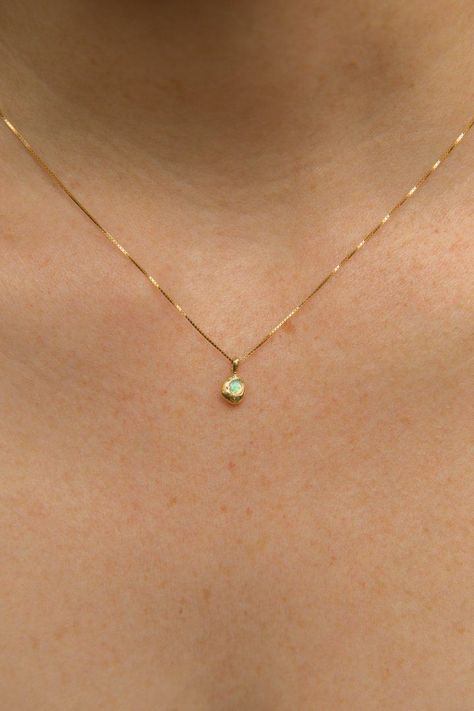 Solid 14k gold settings and dainty box chain. Ethically sourced, genuine 3mm Australian opal. Every stone is unique, varying in shades from blue green to pinky purple. Total width of pendant is approx. 6mm. Hand-formed and cast with recycled yellow gold, giving each one its own unique look and feel. This dainty design comes on a .5mm solid 14k gold box chain. Made ...#World #the #of #Elegance #Simplicity #and #Exploring #Beauty #Jewelry #Jewelry #Gemstone #Exploring #Minimalist #Embracing #of Simple Stone Jewelry, Dainty Gold Chain With Pendant, Simplistic Gold Jewelry, Fine Chain Necklace, Dainty Gold Pendant, Gold Simple Jewelry, Gold Fine Necklace, Simple Gold Necklace Designs, Gold Simple Necklace