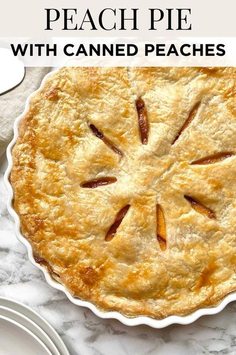 This fresh peach pie recipe is made with a homemade flaky pie crust that's baked to perfection with a sweet peach pie filling made from canned peaches, sugar, cinnamon, nutmeg, vanilla extract, and lemon juice. Save for later! Peach Pie With Jarred Peaches, Southern Peach Pie Recipes, Canned Peach Pie Recipes Easy, Frozen Peach Pie Filling, Easy Peach Pie Filling Canned, Peach Cherry Pie, Sour Cream Peach Pie, Peach Apple Pie, Peach Pies Recipes