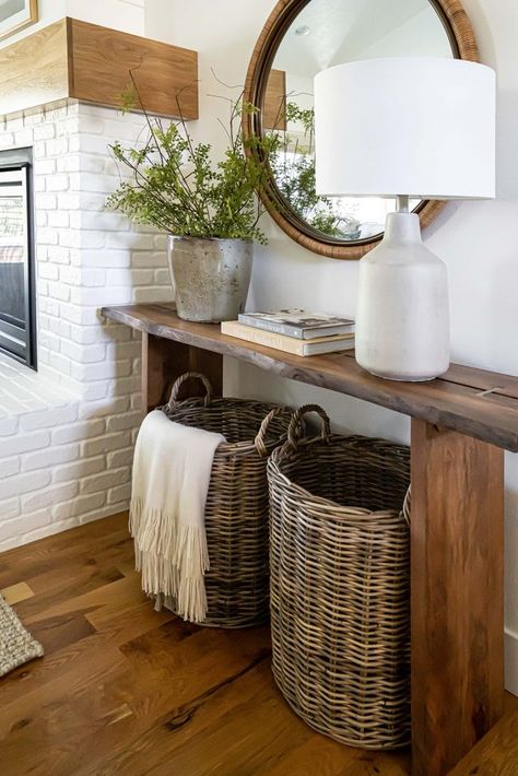 Baskets Under Console Table, Modern Console Table Decor, Decorating With Baskets, Decorate With Baskets, Living Room Baskets, Leather Ottomans, Floor Baskets, Console Table Styling, Console Table Decorating