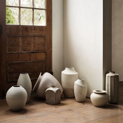 Historical Japanese ceramic works inspired our Nikko collection, which updates classical silhouettes with modern finishes. Cast and glazed by hand, this terracotta mini planter is coated with a white reactive volcanic glaze that textures its curves and angles. Popped in a plant in a nursery pot for an instant upgrade or used as a vase, the planter pairs with our Nikko vases in a graceful group.     Handcast, -trimmed, -sponged, -glazed and -decorated  Terracotta  Reactive volcanic glaze  No drai Ceramic Vase Ideas, Poppy Furniture, Ceramic Photography, Terracotta Vases, Textured Vase, Large Ceramic Vase, White Ceramic Planter, White Ceramic Vase, Wilson Art