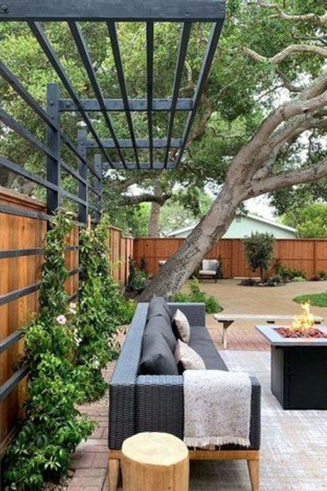 From the perfect space heaters to warm things up to the best decor to create that cozy vibe, here are 15 winter patio ideas that will make your outdoor area a delightful place that you actually want to spend time in, even when it's cold outside. #hunkerhome #winterpatioideas #patioideas #patio #patiodecorideas Privacy Fence With Pergola Top, Trellis Pergola Ideas, Trellis Patio Cover, Oklahoma Backyard Landscaping, Modern Yard Design, Gorgeous Backyards, Pergola Build, Fence Trellis, Backyard Fencing