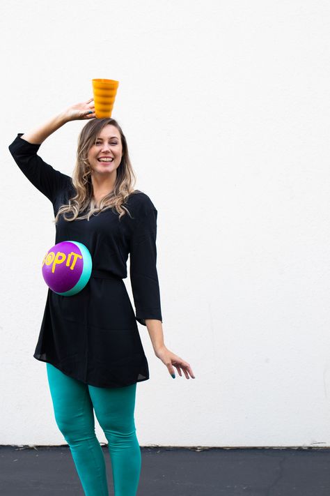 DIY Bop It! Costume // Recreate the classic 90s toy Bop It! with a few simple supplies! This easy 90s toy costume is the perfect nostalgic costume for adults! #costume #halloween #90s #toycostume #adultcostume #halloweencostume #diycostume Lisa Frank Costume, Funny Pregnant Halloween Costumes, Maternity Halloween Costumes, Beanie Baby Costumes, It Costume, Toy Costume, Maternity Halloween, Bop It, Paper Doll Costume