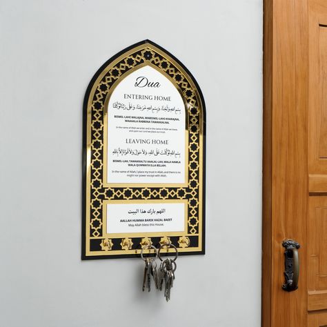 🎉 Every action, no matter how mundane, holds the potential for spiritual significance. This includes something as simple as dua for entering and leaving the home. Introducing our entering & leaving home dua frame with key stands. Features: - Dua for entering & leaving home - 5 key stand - Acrylic material Key Stand, Trust In Allah, Tv Center, Ramadan Cards, In The Name Of Allah, Name Of Allah, Eid Cards, Wooden Music Box, Islamic Decor