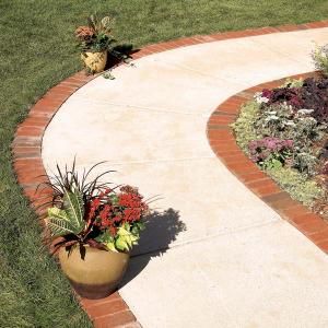 Make an attractive border for a concrete walkway or patio using brick pavers set on a bed of gravel and sand. With a solid gravel base, a brick border will last for the life of your house. Paver Edging, Brick Border, Path Edging, Concrete Path, Brick Edging, Concrete Patios, Brick Walkway, Concrete Walkway, Garden Walkway