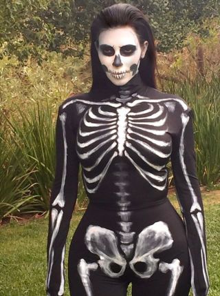 SKELETON: Show off your curves without showing any flesh in this skeleton costume worn by Kim Kardashian West. Get the look with a black body suit decorated with white paint. Get more Halloween inspiration from your favorite celebs here! Kardashian Halloween Costume, Kim Kardashian Halloween, Halloween Costumes Pictures, Gothic Halloween Costumes, Halloween Costumes 2014, Best Celebrity Halloween Costumes, Celebrity Costumes, Skeleton Halloween Costume, Celebrity Halloween