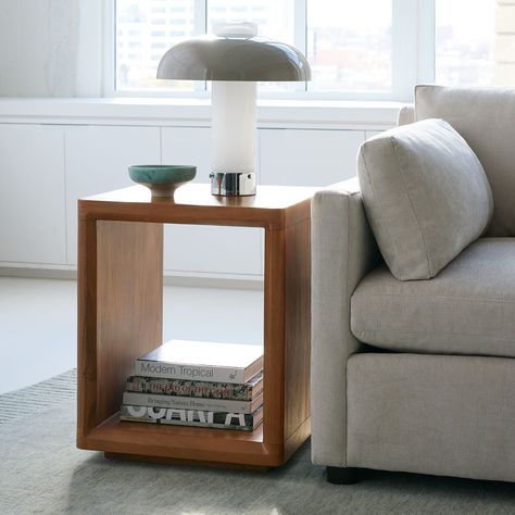 Elevate your space with the sophistication of our CALI END TABLE. Crafted from durable acacia wood in a chic walnut finish, this end table offers open and closed storage options. Its airy, slim design creates a sense of spaciousness, making it the perfect addition to any room. Size Overall: 18"sq. x 22"h Clearance Underneath: 2.2" Product Weight: 43.5 lbs.CareWipe clean with a soft, dry cloth. To protect the finish, avoid use of chemicals and household cleaners. Hardware may loosen over time; periodically check that all connections are tight. Wooden Side Table, Side Table Design, Marble Side Tables, Living Room Side Table, Side And End Tables, Sofa Side Table, Modern Side Table, Color Cafe, Round Side Table